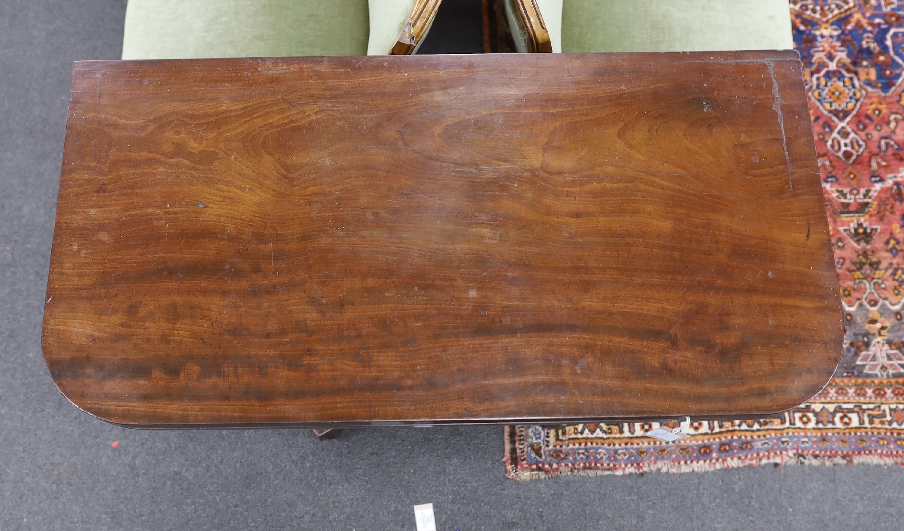 An early Victorian mahogany rectangular folding card table, width 91cm, depth 45cm, height 76cm